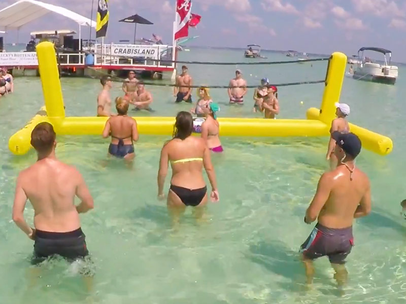 People Playing Volleyball in the water Crab Island