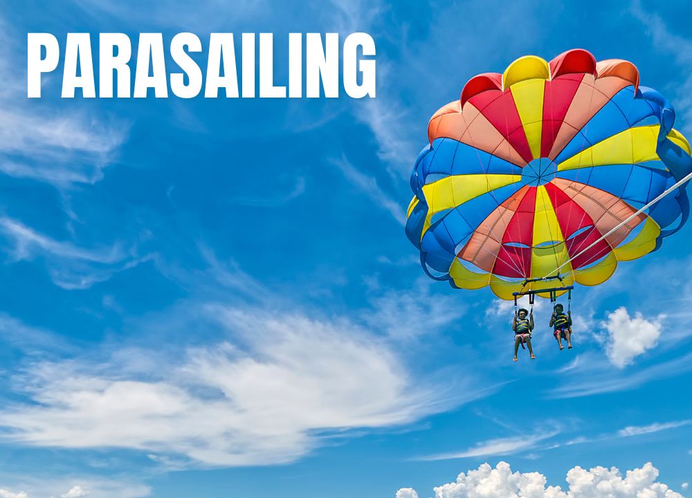 Image of a woman riding a parasail high above the gulf of mexico in destin florida